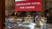 Un cartel de cierre en un pequeño comercio